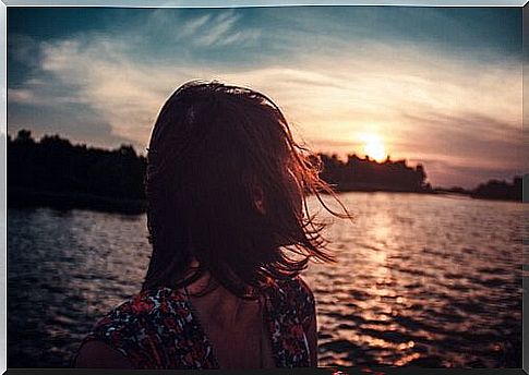 Woman looking back at the sea