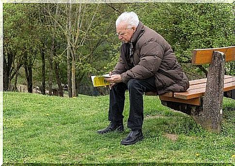 Elderly man reads