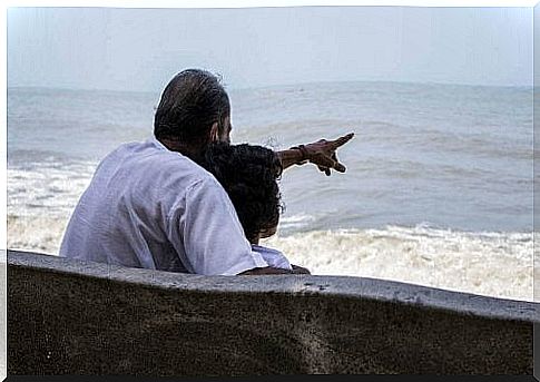 Grandpa and grandson on the beach