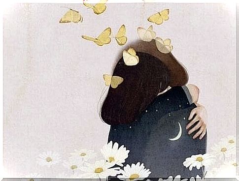 Two people hug under butterflies