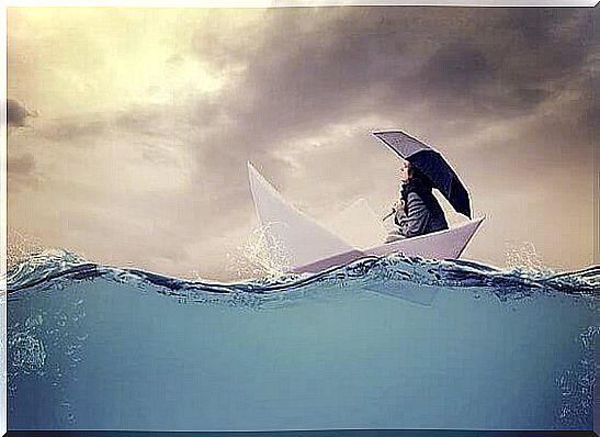 Woman sitting in a paper boat