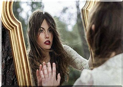 Woman looking in a mirror