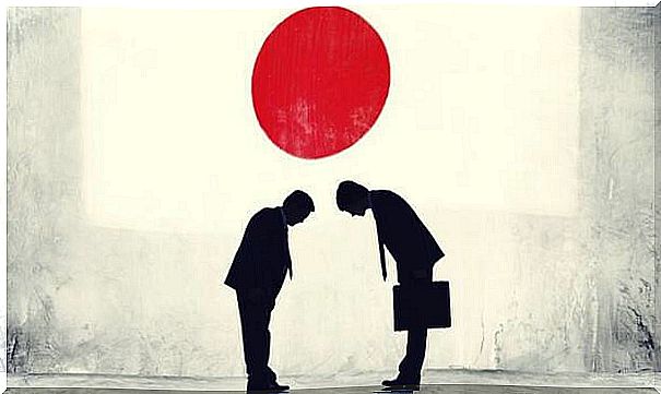 Japanese businessmen bow to each other