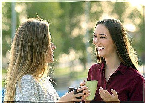 Girlfriends have a coffee and talk together