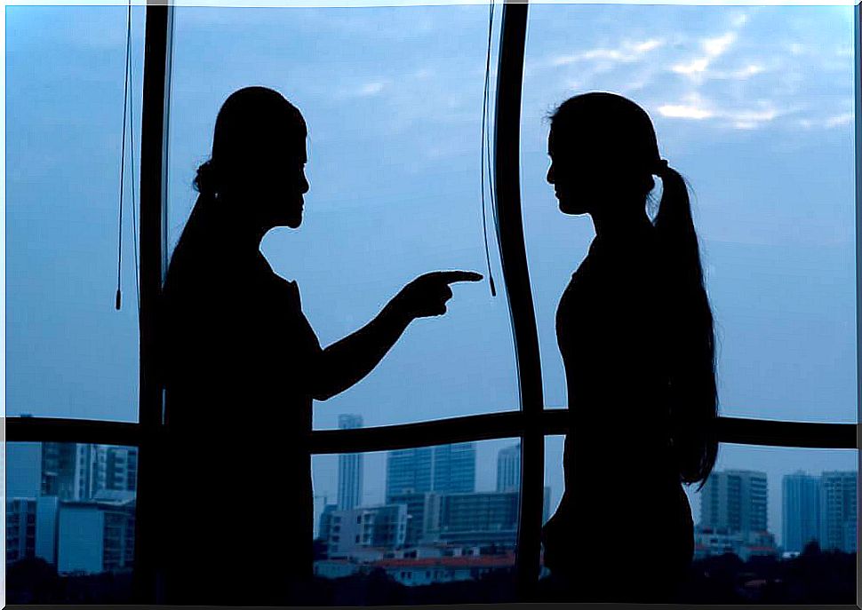 Two women are arguing with each other