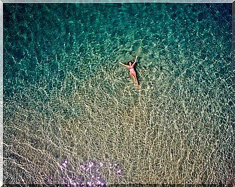 Woman floating in the sea