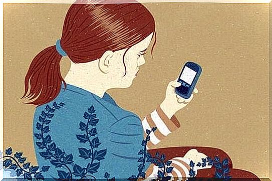 A girl is playing with the cell phone.